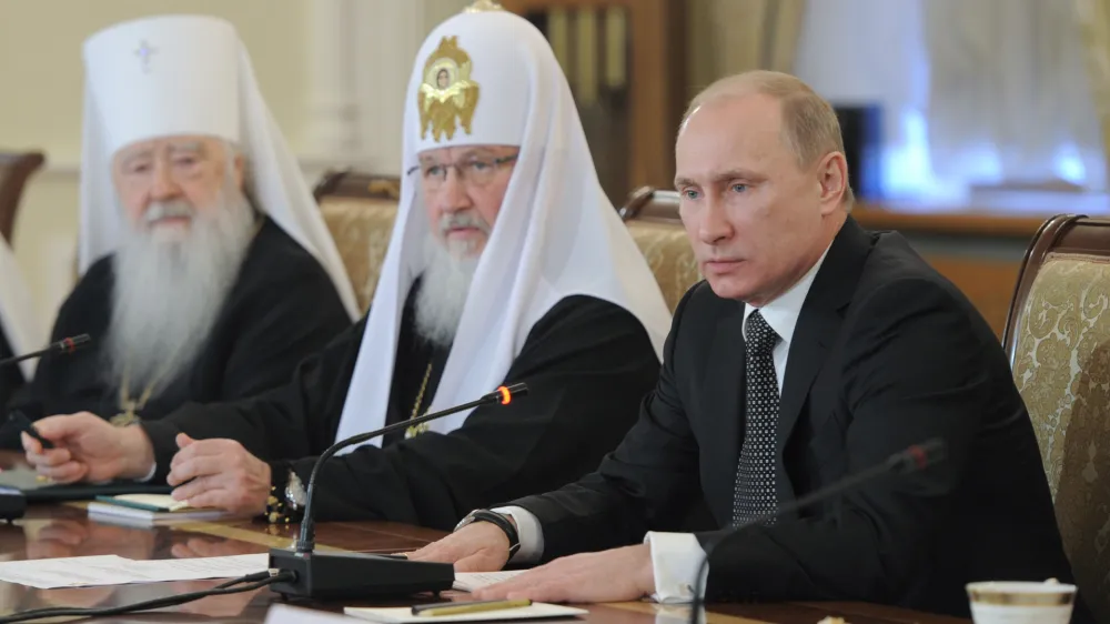 From right, Russian Prime Minister and presidential candidate Vladimir Putin, Russian Orthodox Patriarch Kirill and Metropolitan Yuvenaly of Krutitsa and Kolomna, during a meeting with Russia's religious leaders in the St. Daniel Monastery in Moscow, Wednesday, Feb. 8, 2012. (AP Photo/RIA-Novosti, Yana Lapikova, Government Press Service)