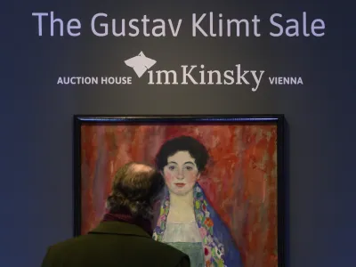 A man looks at the painting 'Portrait of Fr&auml;ulein Lieser' by Austrian painter Gustav Klimt prior to an auction, in Vienna, Wednesday, April 24, 2024. A portrait of a young woman by Gustav Klimt that was long believed to be lost has been sold at an auction in Vienna for 30 million euros ( million). The Austrian modernist artist started work on the "Portrait of Fr&auml;ulein Lieser" in 1917, the year before he died, and it is one of his last works. (AP Photo/Christian Bruna)