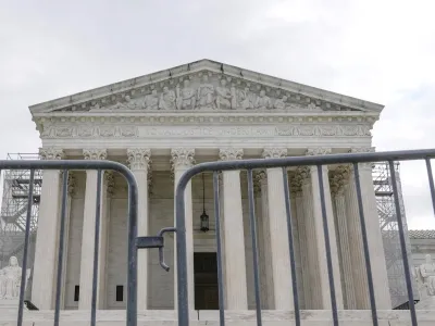 The Supreme Court is seen during a protest outside the as the justices prepare to hear arguments over whether&nbsp;Donald Trump is immune from prosecution in a case charging him with plotting to overturn the results of the 2020 presidential election, on Capitol Hill Thursday, April 25, 2024, in Washington. (AP Photo/Mariam Zuhaib)