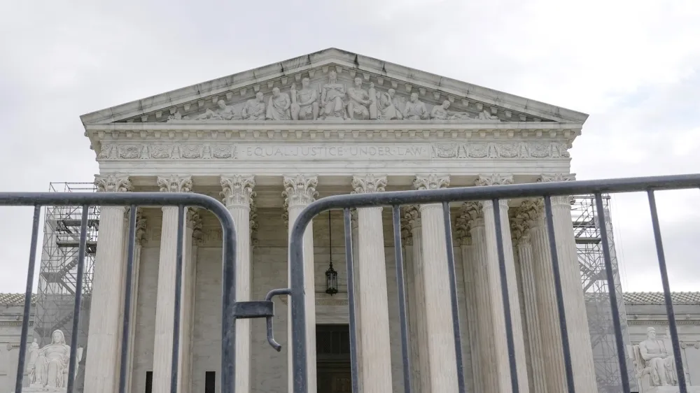 The Supreme Court is seen during a protest outside the as the justices prepare to hear arguments over whether&nbsp;Donald Trump is immune from prosecution in a case charging him with plotting to overturn the results of the 2020 presidential election, on Capitol Hill Thursday, April 25, 2024, in Washington. (AP Photo/Mariam Zuhaib)