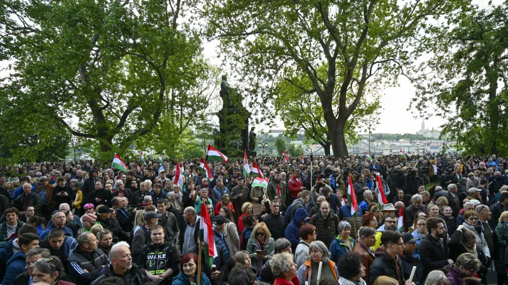 People protest outside the Hungarian Interior Ministry building to demand stronger protections for children and Interior minister Sandor Pinter to step down, in Budapest, Hungary, Friday, April 26, 2024. Peter Magyar, a former insider within Orban's ruling Fidesz party, lead a protest. The demonstration was the latest in a series of large anti-government protests that Magyar has mobilized in recent weeks, and comes as the political newcomer is campaigning for EU elections this June with his new party, Respect and Freedom (TISZA). (AP Photo/Denes Erdos)