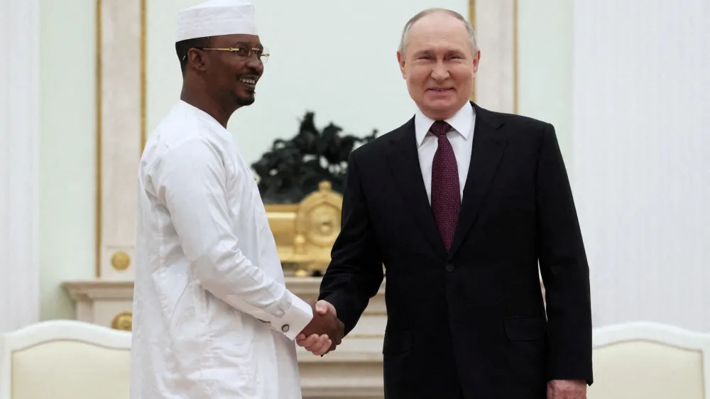 FILE PHOTO: Russia's President Vladimir Putin shakes hands with Chad's interim President Mahamat Idriss Deby during a meeting at the Kremlin in Moscow, Russia January 24, 2024. Sputnik/Mikhail Metzel/Pool via REUTERS ATTENTION EDITORS - THIS IMAGE WAS PROVIDED BY A THIRD PARTY./File Photo
