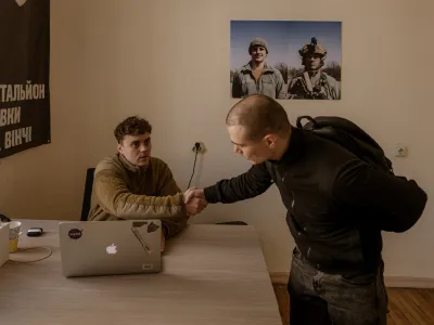 KYIV, UKRAINE - APRIL 10: Maksym, a former actor in charge of the recruiting center, talks to Dmytro Jasynok from Sumy who decided to voluntarily join the unit after a bomb fell 100 meters from his home, at Recruiting Center of Da Vinci Wolves Battalion from Ukrainian Army in Kyiv, Ukraine on April 10, 2024. After the president Zelenskyy signed new mobilization law in Ukraine, military conscription age is lowered from 27 to 25 in an effort to replenish its depleted ranks after more than two years of war. Andre Luis Alves / AnadoluNo Use USA No use UK No use Canada No use France No use Japan No use Italy No use Australia No use Spain No use Belgium No use Korea No use South Africa No use Hong Kong No use New Zealand No use Turkey