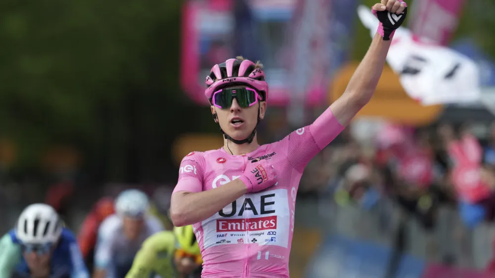 Slovenia's Pogacar Tadej celebrates winning the 8th stage of the Giro d'Italia cycling race, from Spoleto to Prati di Tivo, Italy, Saturday, May 11 2024 Italy. (Gian Mattia D'Alberto/LaPresse via AP)
