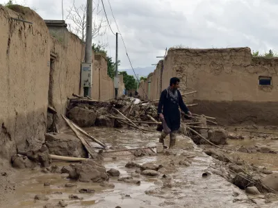 An Afghan man walks near his damaged home after heavy flooding in Baghlan province in northern Afghanistan Saturday, May 11, 2024. Flash floods from seasonal rains in Baghlan province in northern Afghanistan killed dozens of people on Friday, a Taliban official said. (AP Photo/Mehrab Ibrahimi)