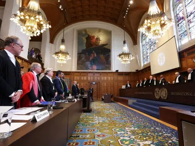 South African and Israeli delegations stand in front of judges at the International Court of Justice (ICJ), at the start of a hearing where South Africa requests new emergency measures over Israel's attacks on Rafah, as part of an ongoing case South Africa filed at the ICJ in December last year accusing Israel of violating the Genocide Convention during its offensive against Palestinians in Gaza, in The Hague Netherlands May 16, 2024. REUTERS/Yves Herman