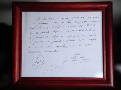 FILE - A framed copy of the napkin linking the 13-year-old Lionel Messi to FC Barcelona is seen in Barcelona, Spain on Jan. 5, 2012. British auction house Bonhams says the famous napkin that linked a young Lionel Messi to Barcelona has sold for 5,000. An agreement in principle to sign then 13-year-old Messi was written on the napkin almost 25 years ago at a Barcelona tennis club. (AP Photo/Manu Fernandez, File)
