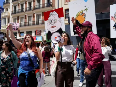 People protest the visit of Argentinean President Javier Milei as he is expected to attend the meeting of Spanish far-right party Vox, among others like Vox party leader Santiago Abascal, Marine Le Pen, president of the French far-right National Rally (Rassemblement National - RN), and Hungarian Prime Minister Viktor Orban, in Madrid, Spain, May 18, 2024. REUTERS/Ana Beltran
