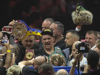 Ukraine's Oleksandr Usyk celebrates after beating Britain's Tyson Fury in their undisputed heavyweight world championship boxing fight at the Kingdom Arena in Riyadh, Saudi Arabia, Sunday, May 19, 2024. (AP Photo/Francisco Seco)