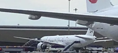 The Boeing 777-300ER aircraft of Singapore Airlines, flight SQ321 from Heathrow is seen on tarmac after requesting an emergency landing at Bangkok's Suvarnabhumi International airport, Thailand, Tuesday, May 21, 2024. One person has died aboard a London-Singapore flight that encountered severe turbulence, Singapore Airlines said Tuesday, in which the plane apparently plummeted for a number of minutes before it was diverted to Bangkok, where emergency crews rushed to help injured passengers amid stormy weather. (Pongsakorn Rodphai via AP)