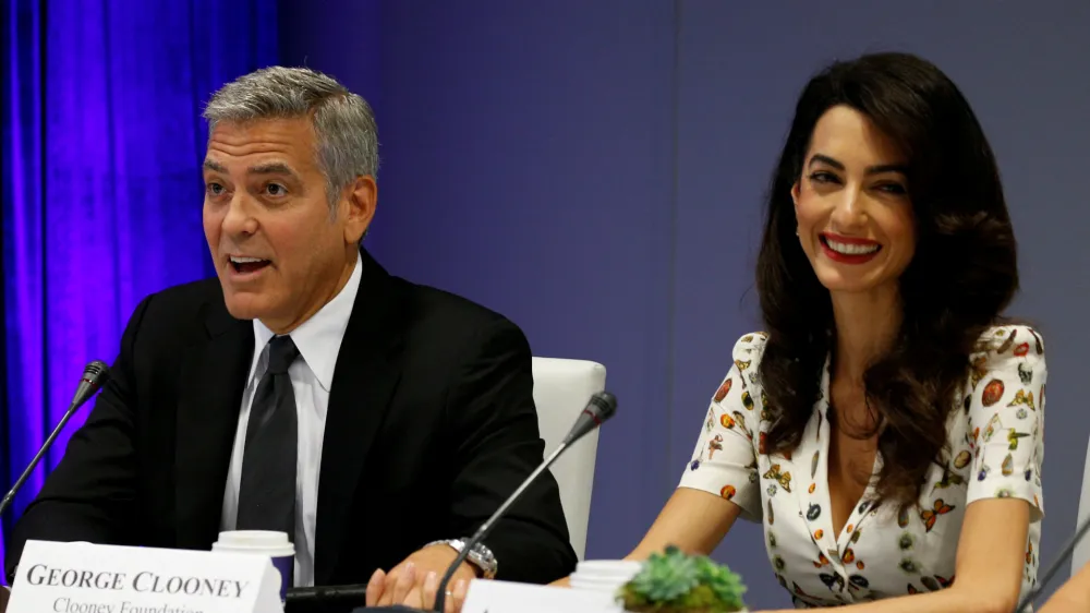 FILE PHOTO - Actor George Clooney and his wife Amal attend a CEO roundtable at the United Nations during the United Nations General Assembly in New York, U.S. on September 20, 2016. REUTERS/Kevin Lamarque/File Photo