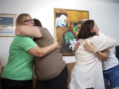 Members of the association Mothers of Srebrenica react after the United Nations General Assembly adopted a resolution declaring July 11 the International Day of Reflection and Commemoration of the 1995 genocide in Srebrenica, in Potocari, Bosnia, Thursday, May 23, 2024. (AP Photo/Armin Durgut)