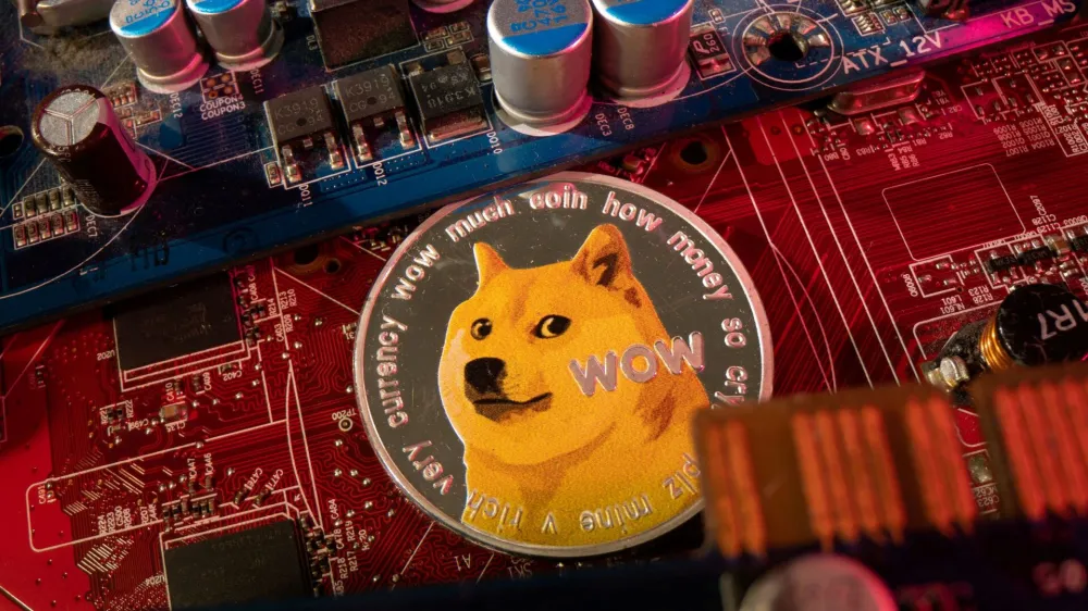 FILE PHOTO: A representation of cryptocurrency Dogecoin is placed on a PC motherboard, in this illustration taken June 16, 2023. REUTERS/Dado Ruvic/Illustration/File Photo