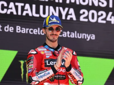 MotoGP - Catalunya Grand Prix - Circuit de Barcelona-Catalunya, Barcelona, Spain - May 26, 2024 Ducati Lenovo Team's Francesco Bagnaia celebrates on the podium after winning the Catalunya Grand Prix REUTERS/Bruna Casas