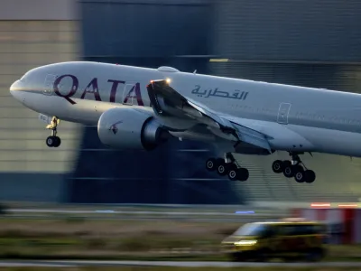 FILE - A Qatar airways plane lands at the airport in Frankfurt, Germany, as the sun rises on Sept. 25, 2023. Twelve people were injured when a Qatar Airways plane flying from Doha to Dublin on Sunday May 26, 2024 hit turbulence, airport authorities said. (AP Photo/Michael Probst, File)