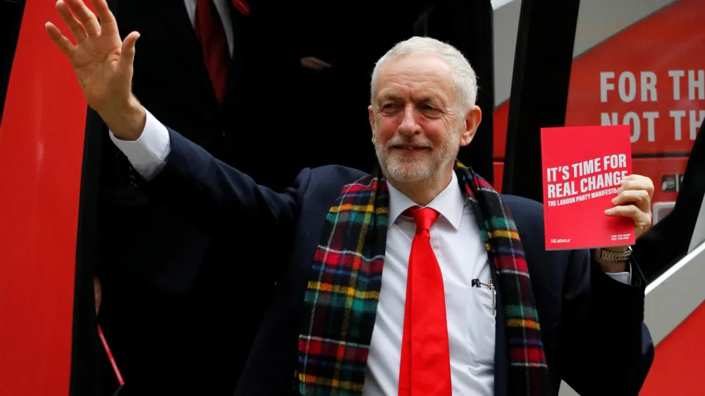 Leader of the Labour Party Jeremy Corbyn waves as he gets off the campaign bus ahead of the launch of the party manifesto in Birmingham, Britain November 21, 2019. REUTERS/Phil Noble - RC2MFD92D9YV