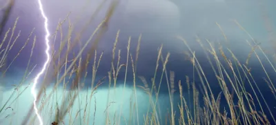 A lightning bolt hits the ground during a storm near O'Fallon, Ill., Monday, July 4, 2005. (AP Photo/The Post-Dispatch, Gabriel B. Tait)