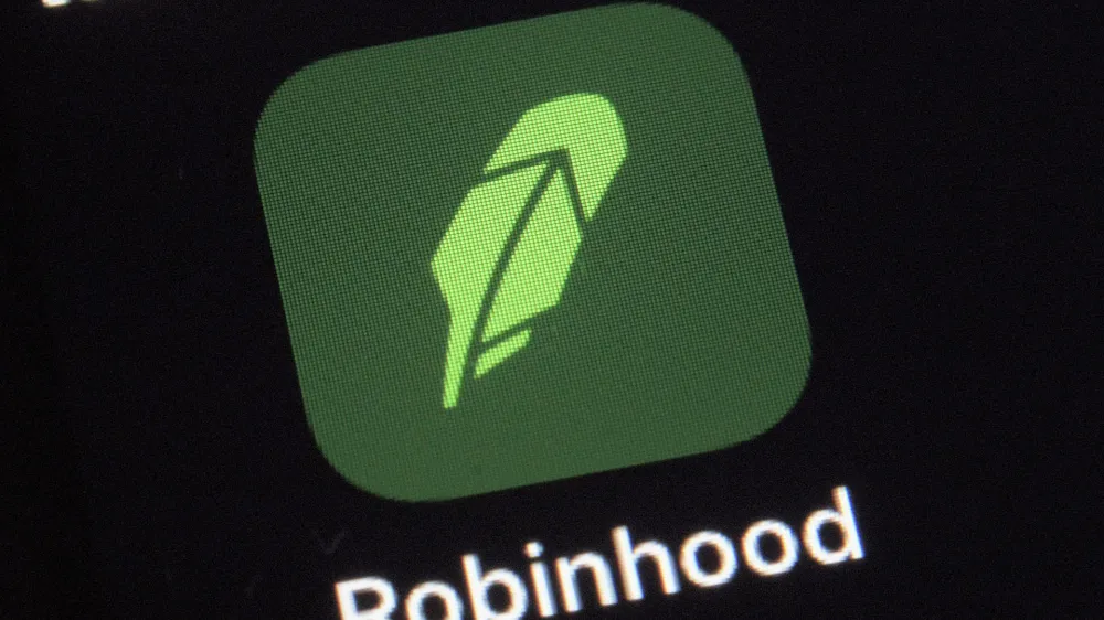 FILE - This Dec. 17, 2020, photo shows the logo for the Robinhood app on a smartphone in New York. Robinhood, the online brokerage that found itself embroiled in this year's meme stock phenomenon, will seek to go public with a market valuation of up to $35 billion. The company said in a regulatory filing on Monday, July 19, 2021, that it wanted to price the 55 million shares in its initial public offering in a range of $38 to $42 per share. It could raise approximately $2.3 billion if shares are sold at the high end of the range. (AP Photo/Patrick Sison, File)
