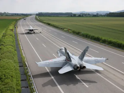 Swiss Air Force F/A-18 fighter jets are seen on the motorway during the Alpha Uno drill in Payerne, Switzerland, June 5, 2024. Philipp Schmidli/Swiss Army/Handout via REUTERS ATTENTION EDITORS - THIS IMAGE HAS BEEN SUPPLIED BY A THIRD PARTY. NO RESALES. NO ARCHIVES