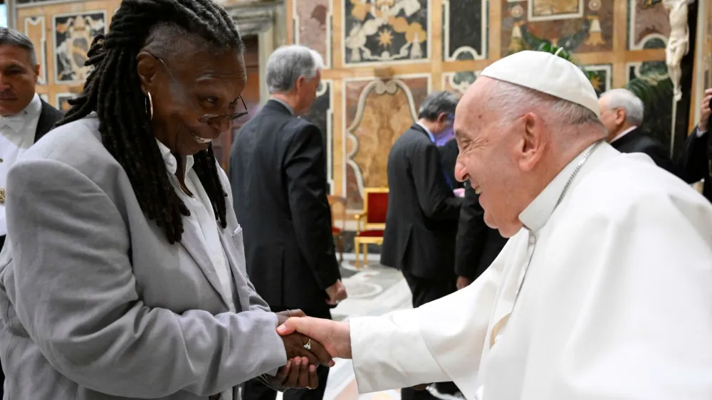 Pope Francis greets Whoopi Goldberg as he meets with comedians during a cultural event at the Vatican, June 14, 2024. Vatican Media/&shy;Handout via REUTERS  ATTENTION EDITORS - THIS IMAGE WAS PROVIDED BY A THIRD PARTY. BEST QUALITY AVAILABLE.