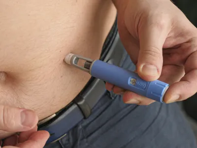 obese fat man injecting Semaglutide Ozempic injection control blood sugar levels