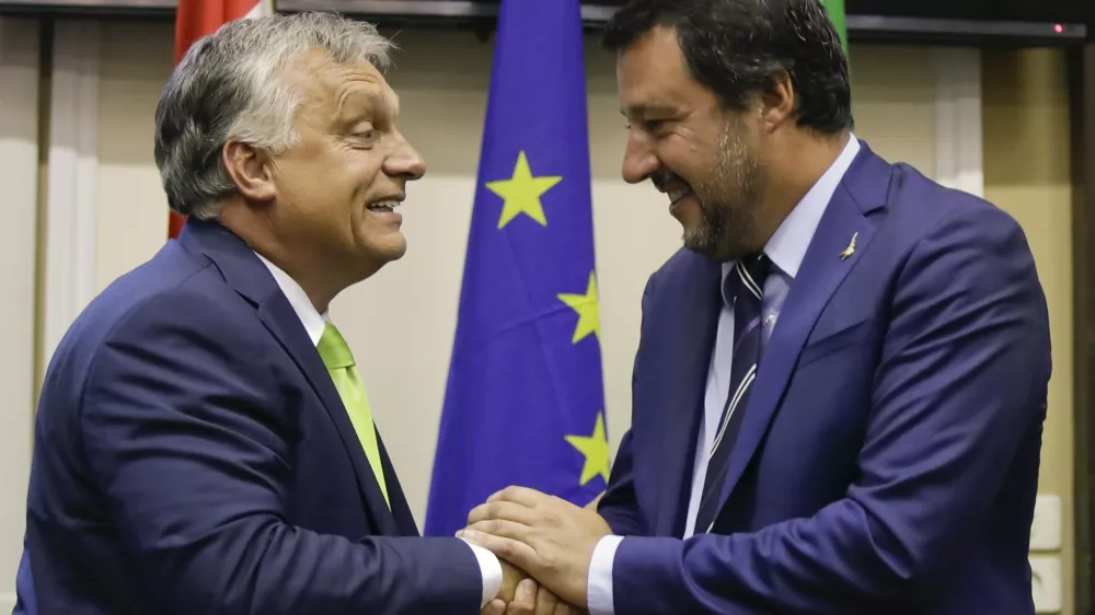 Italy's Interior Minister and Deputy-Premier Matteo Salvini, right, shakes hand with Hungary's Prime Minister Viktor Orban after their meeting in Milan, Italy, Tuesday, Aug. 28, 2018. (AP Photo/Luca Bruno)
