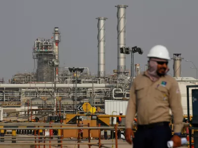 FILE PHOTO: An employee looks on at Saudi Aramco oil facility in Abqaiq, Saudi Arabia October 12, 2019. REUTERS/Maxim Shemetov//File Photo