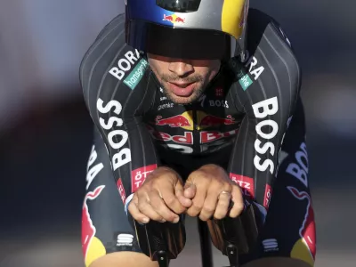 Primoz Roglic, of Slovenia, crosses the finish line in the first stage of the tour of Spain, La Vuelta, cycling race, an individual time trial with start in Lisbon and finish in Oeiras, Portugal, Saturday, Aug. 17, 2024. (AP Photo/Pedro Rocha)