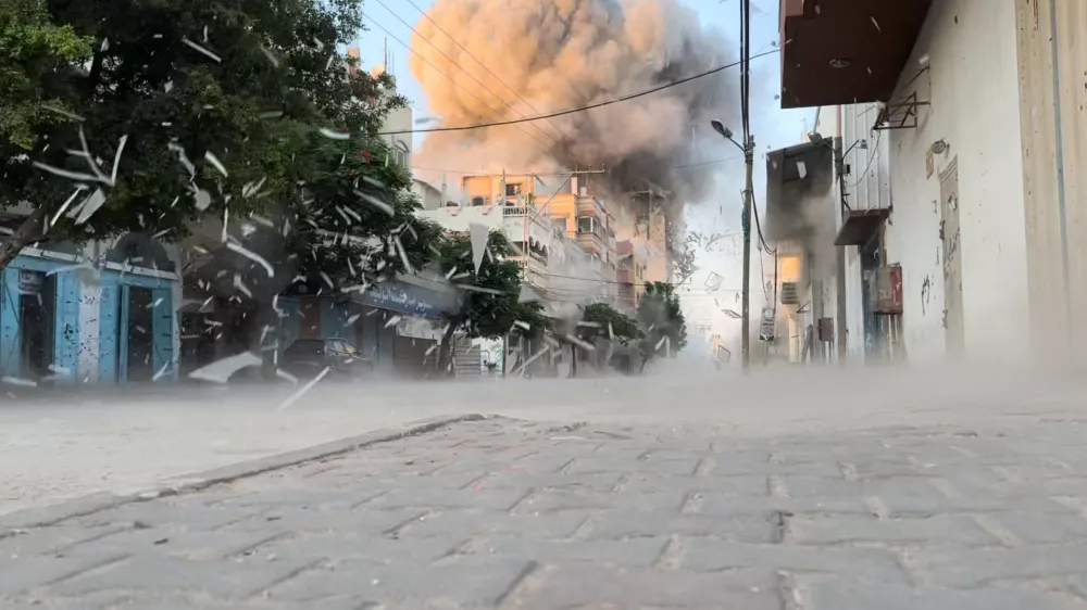 Smoke rises following an Israeli strike on a residential building, amid the ongoing conflict between Israel and Hamas, Nuseirat in the central Gaza Strip, in this screen grab taken from a video, August 18, 2024. Reuters TV via REUTERS