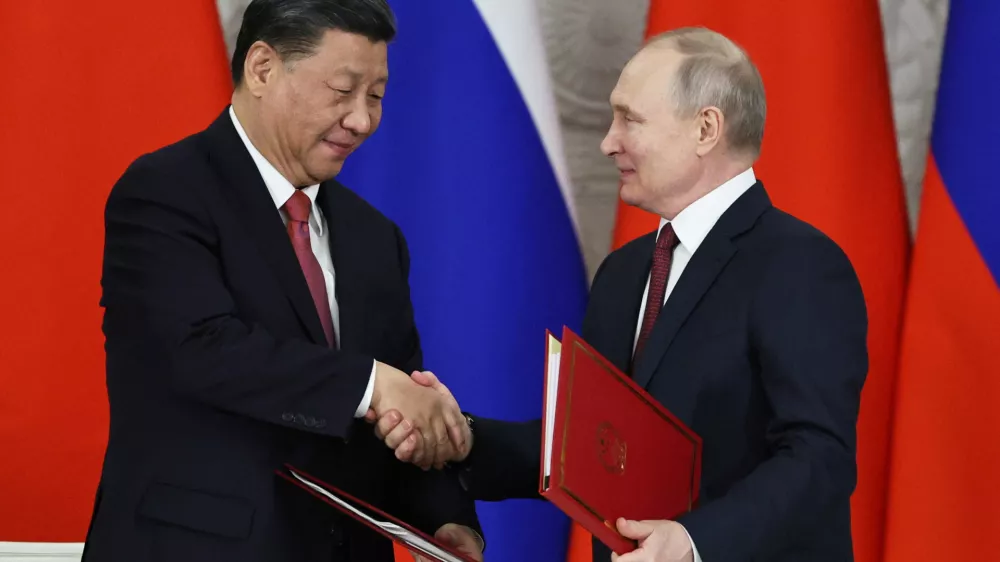 Russian President Vladimir Putin shakes hands with Chinese President Xi Jinping during a signing ceremony following their talks at the Kremlin in Moscow, Russia March 21, 2023. Sputnik/Mikhail Tereshchenko/Pool via REUTERS ATTENTION EDITORS - THIS IMAGE WAS PROVIDED BY A THIRD PARTY.