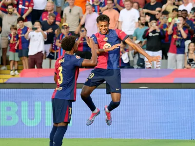 Soccer Football - LaLiga - FC Barcelona v Athletic Bilbao - Estadi Olimpic Lluis Companys, Barcelona, Spain - August 24, 2024 FC Barcelona's Lamine Yamal celebrates scoring their first goal with Alejandro Balde REUTERS/Nacho Doce