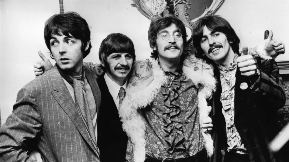 19th May 1967: The Beatles celebrate the completion of their new album, 'Sgt Pepper's Lonely Hearts Club Band', at a press conference held at the west London home of their manager Brian Epstein. The LP is released on June 1st. (Photo by John Pratt/Keystone/Getty Images)