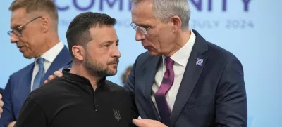 FILE PHOTO: Ukrainian President Volodymyr Zelenskiy speaks to the Nato Secretary General Jens Stoltenberg before the first plenary session at the European Political Community meeting at Blenheim Palace in Woodstock, Britain, Thursday, July 18, 2024. Kin Cheung/Pool via REUTERS/File Photo