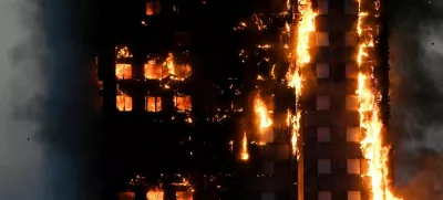 FILE PHOTO: The Grenfell Tower residential building is seen on fire in London, Britain, June 14, 2017. REUTERS/Toby Melville/File Photo