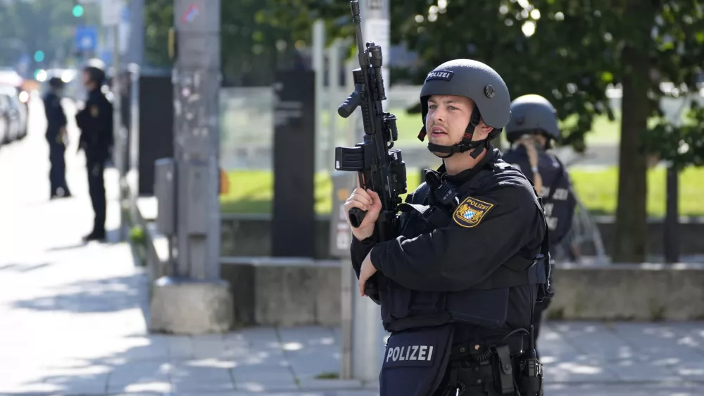 Police officers patrol near a scene after police fired shots at a suspicious person near the Israeli Consulate and a museum on the city's Nazi-era history in Munich, Germany, Thursday, Sept. 5, 2024. (AP Photo/Matthias Schrader)