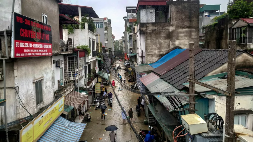 FILE PHOTO: A view of a flooded street following the impact of Typhoon Yagi, in Hanoi, Vietnam, September 11, 2024. REUTERS/Khanh Vu/File Photo
