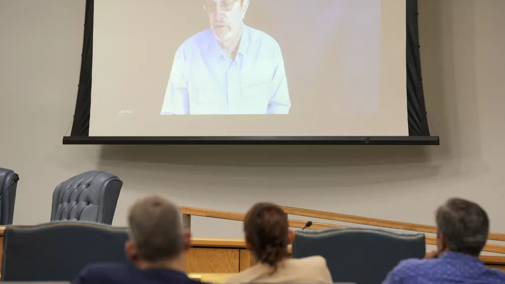 Steven Ross, former OceanGate scientific director, top, speaks via video link as he testifies during the Titan marine board formal hearing inside the Charleston County Council Chambers, Thursday, Sept. 19, 2024, in North Charleston, S.C. (Corey Connor via AP, Pool)