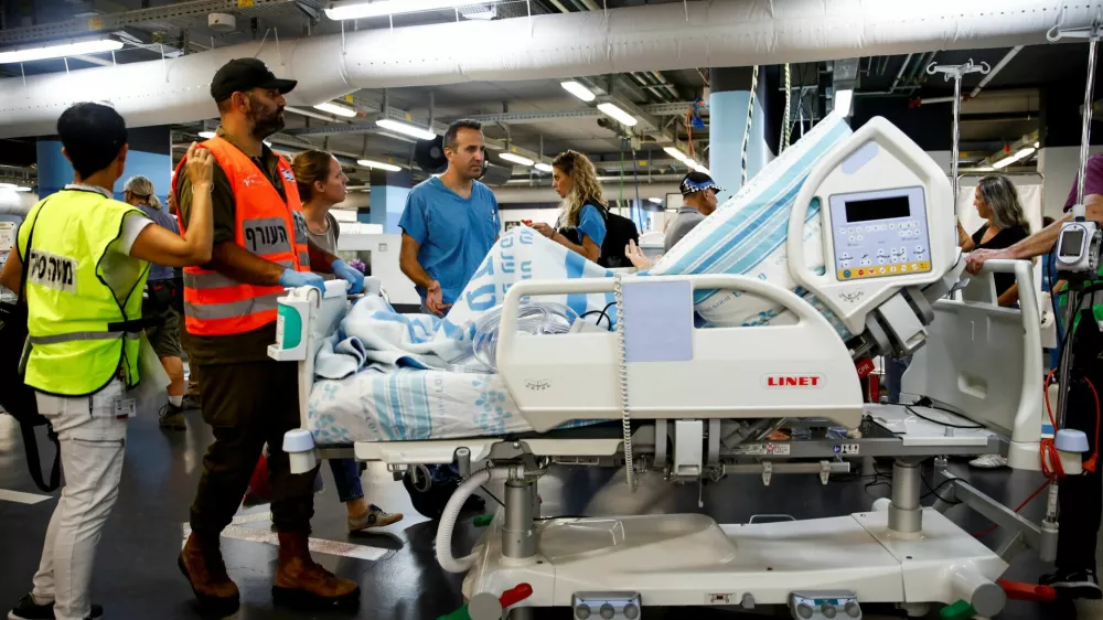Medical staff move a bed of a patient to an underground emergency hospital in a parking lot at Rambam Health Care Campus, amid cross-border hostilities between Hezbollah and Israel, in Haifa, Israel September 22, 2024. REUTERS/Shir Torem