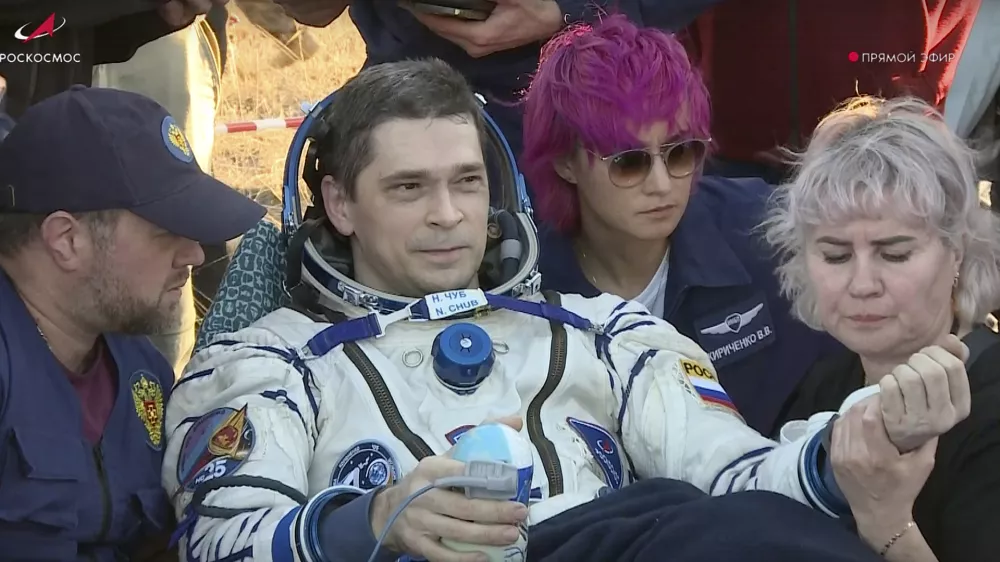 In this photo taken from video released by Roscosmos space corporation, Roscosmos cosmonaut Nikolai Chub sits in a chair shortly after the landing of the Russian Soyuz MS-25 space capsule carrying NASA astronaut Tracy Dyson, Roscosmos cosmonauts Oleg Kononenko and Nikolai Chub, south-east of the Kazakh town of Zhezkazgan, Kazakhstan, Monday, Sept. 23, 2024. (Roscosmos space corporation via AP)