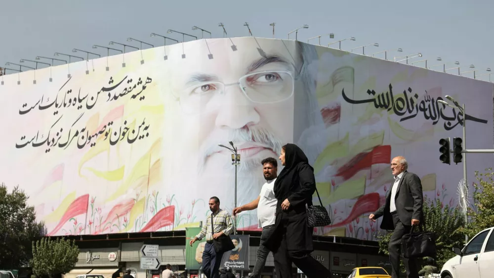 People walk past a billboard with a picture of the late Lebanon's Hezbollah leader Hassan&nbsp;Nasrallah, in a street in Tehran, Iran October 2, 2024. Majid Asgaripour/WANA (West Asia News Agency) via REUTERS ATTENTION EDITORS - THIS IMAGE HAS BEEN SUPPLIED BY A THIRD PARTY.