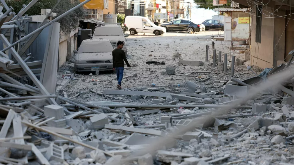 A person inspects the damage, following Israeli strikes, amid the ongoing hostilities between Hezbollah and Israeli forces, in Tyre, southern Lebanon, October 23, 2024. REUTERS/Aziz Taher
