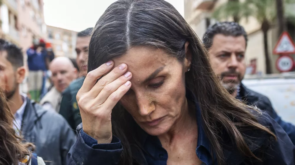Spain's Queen Letizia reacts as she visits people affected by the floods in Paiporta, near Valencia, Spain, Sunday Nov. 3, 2024. (AP Photo/David Melero)