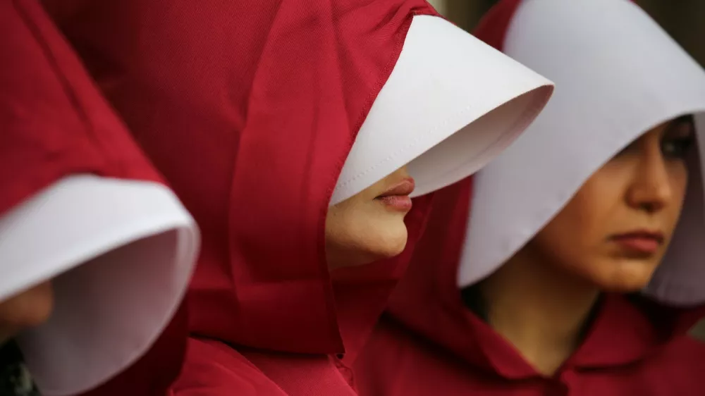November 8, 2024, London, England, UK: Protesters dressed in Housemaid's Tale style costumes that allow only small parts of their faces to be visible meet in Parliament Square. Protesters wear costumes inspired by the Handmaid's Tale that are recognised as a symbol of female oppression faced by women of Iran. The protesters are also highlighting the plight of AHOO DARYAEI who stripped down to her underwear after being harassed by paramilitary forces for not wearing the hijab correctly on November 02 2024 she remains detained. This action has turned her into symbol of resistance against Iran's strict dress code laws.,Image: 931967737, License: Rights-managed, Restrictions:, Model Release: no / Foto: Martin Pope