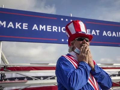 Phil Eason wears an Uncle Sam costume during the Make America Great Again Victory rally with Vice President Mike Pence at the Piedmont Triad International Airport in Greensboro, N.C., on Tuesday, Oct. 27, 2020. (Khadejeh Nikouyeh/News & Record via AP)
