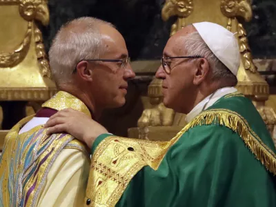 Pope Francis, right, greets the archbishop of Canterbury, Justin Welby, during vespers prayers in the church of San Gregorio al Celio, in Rome, Wednesday, Oct. 5, 2016. Francis joined the archbishop of Canterbury, Justin Welby, for a vigil prayer service Wednesday at Rome's church of St. Gregory. The church is named for the 6th century pope who dispatched missionaries to England to spread Christianity. (AP Photo/Gregorio Borgia)
