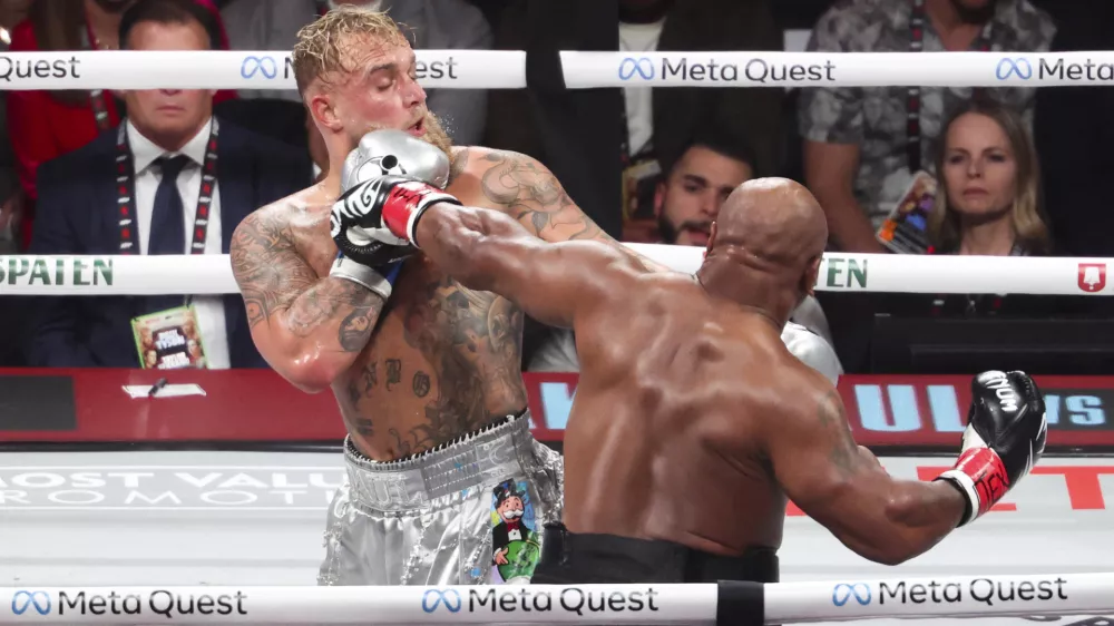 Nov 15, 2024; Arlington, Texas, UNITED STATES; Mike Tyson (black gloves) fights Jake Paul (silver gloves) at AT&T Stadium. Mandatory Credit: Kevin Jairaj-Imagn Images