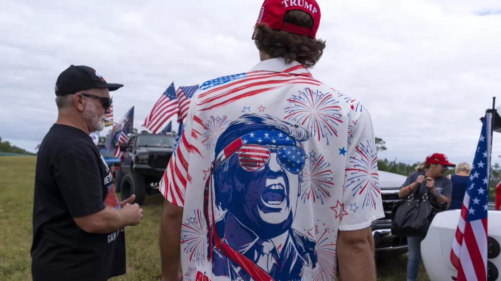 Supporters with decorated trucks and cars gather for a victory parade for President-elect Donald Trump, Sunday, Nov. 17, 2024, in West Palm Beach, Fla. (AP Photo/Alex Brandon)