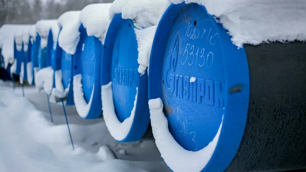 2BREMR0 Barnaul, Russia-13.12.2018: pipes for gasification with the inscription Gazprom lie in an open warehouse in winter.
