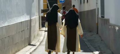 EDM5TN Two nuns walking through Seville Spain