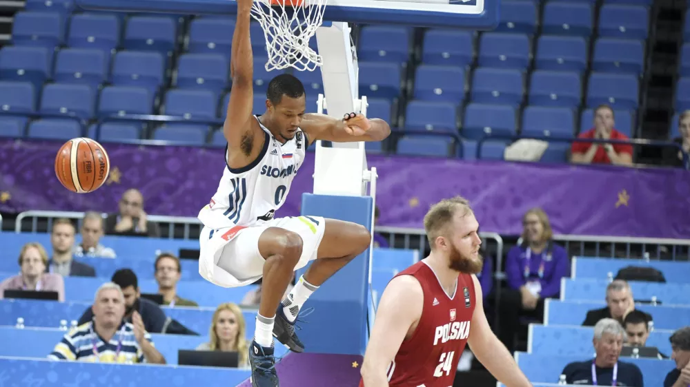 Slovenia's Anthony Randolph dunks the ball as Poland's Przemyslaw Karnowski, right, looks on during their Eurobasket European Basketball Championship match in Helsinki, Thursday Aug. 31. 2017. (Juss Nukari/Lehtikuva via AP)